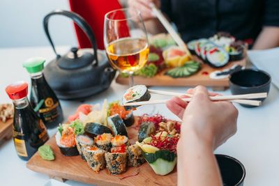 People eating food served on table