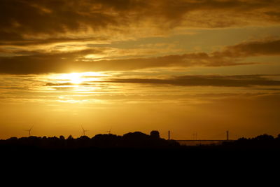 Scenic view of silhouette landscape against sky during sunset