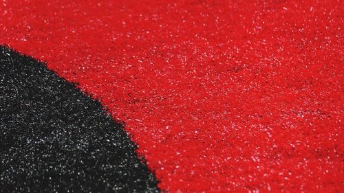 Full frame shot of red and black astroturf