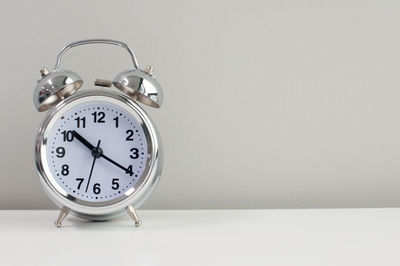 Close-up of clock on table