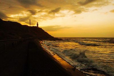 Scenic view of sea at sunset