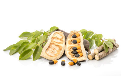 Close-up of fresh fruits against white background