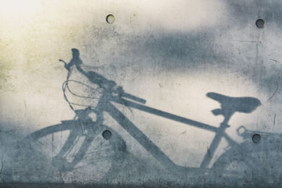 Shadow of bicycle on wall