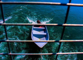 A framing of a boat on blue lake water at kenyir lake, hulu terengganu, malaysia.