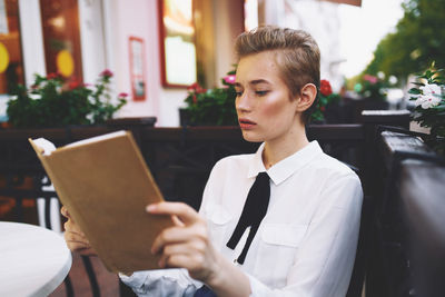 Young man using digital tablet while sitting at home