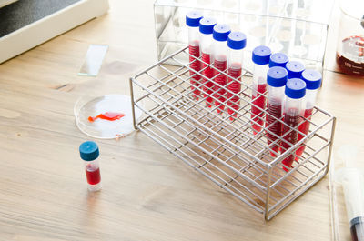 High angle view of chemical in test tubes on table