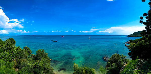 Scenic view of sea against blue sky