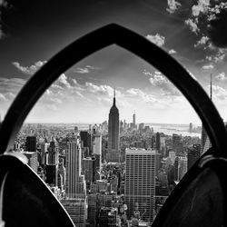 Cityscape against cloudy sky