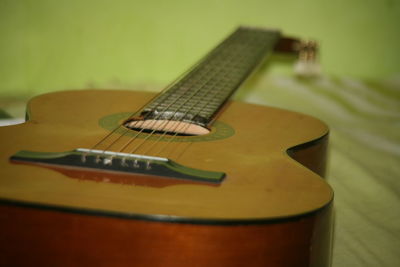 Close-up of guitar on table