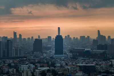 Cityscape against sky during sunset