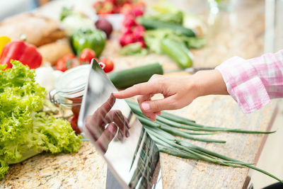 Midsection of woman preparing food