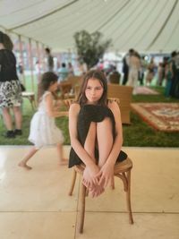 Portrait of a woman sitting on seat