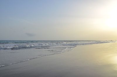 Scenic view of beach against sky during sunset