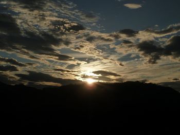 Sun shining through clouds