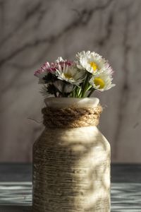 Close-up of white flower vase on table