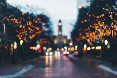 Defocused image of illuminated city at night