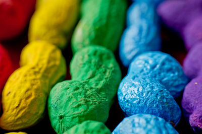 Close-up of colorful peanuts on table