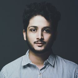 Portrait of man against gray background