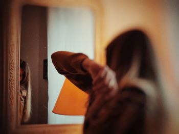 Low section of woman standing at home