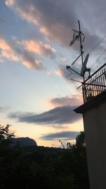 Low angle view of silhouette trees against sky during sunset