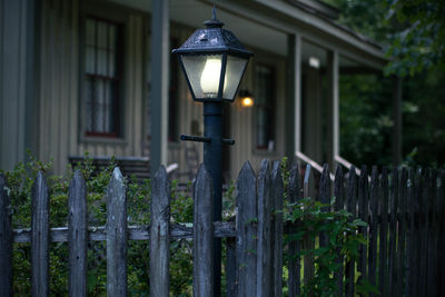 Illuminated street light in front of building