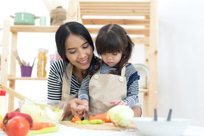 Mother and girl looking at food