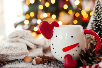 Christmas still life with cup of coffee, cookie and decorations. high quality photo