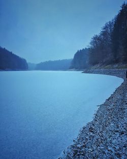 Scenic view of lake against blue sky