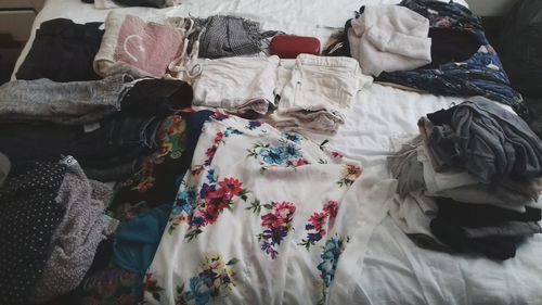 Full frame shot of clothes hanging on bed