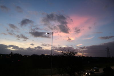 Road against cloudy sky at dusk