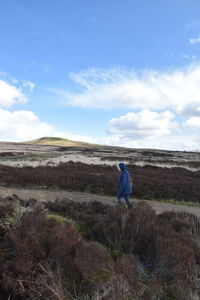 Rear view of man looking at landscape