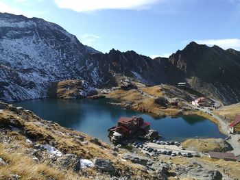 Scenic view of lake and mountains against sky