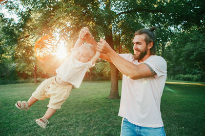 Full length of father with daughter in park