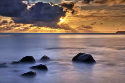 Scenic view of sea against sky during sunset