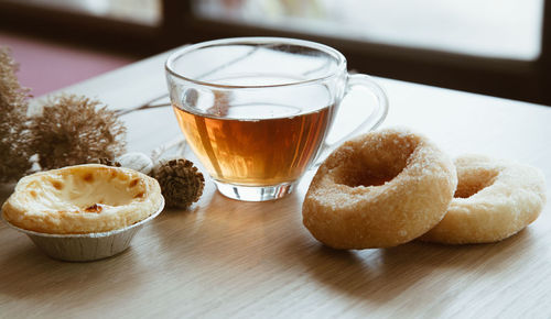 Close-up of coffee and drink on table
