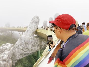 Side view of man working at a bridge