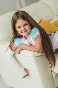 Portrait of young woman sleeping on bed at home