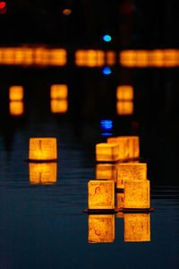 Close-up of illuminated text on table