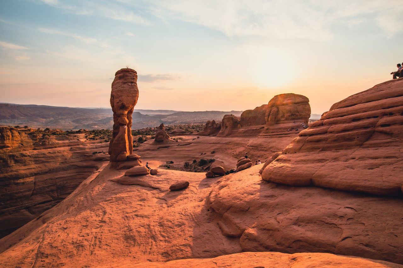 ROCK FORMATIONS ON LANDSCAPE DURING SUNSET