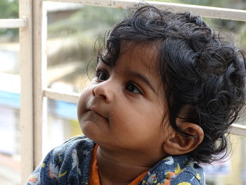 Close up of cute toddler looking away