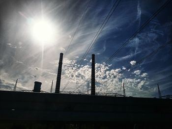 Low angle view of smoke stack against sky