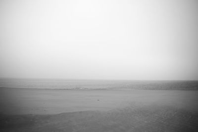 Scenic view of calm sea against clear sky