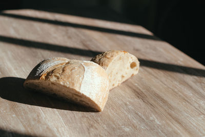 High angle view of bread on cutting board