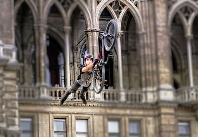 Statue against historic building in city