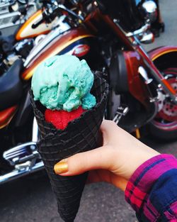 Cropped image of hand holding ice cream