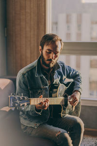 Young man playing guitar