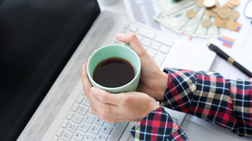 High angle view of coffee cup on table