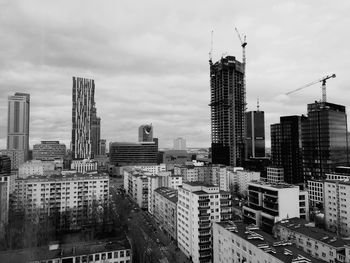 Modern buildings in city against sky