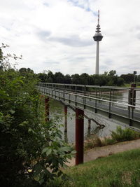 View of communications tower against cloudy sky