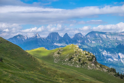 Scenic view of landscape and mountains against sky